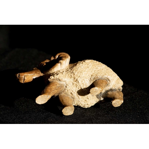 200 - A contemporary stone sculpture of an American Bighorn Sheep in the round with smoothly carved limbs ... 