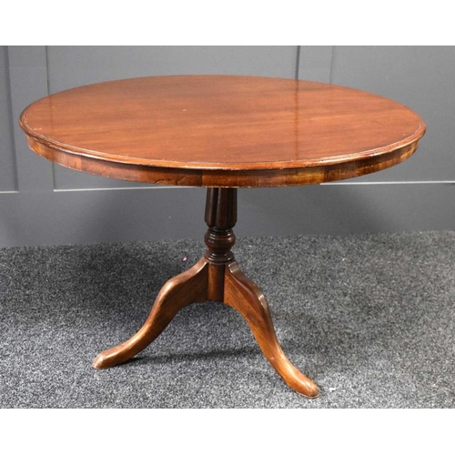 459 - A Victorian mahogany circular top centre table with tilt top, lobed column and three outswept feet, ... 