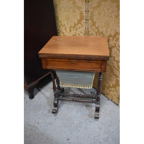 462 - A Victorian mahogany work table with games table top.