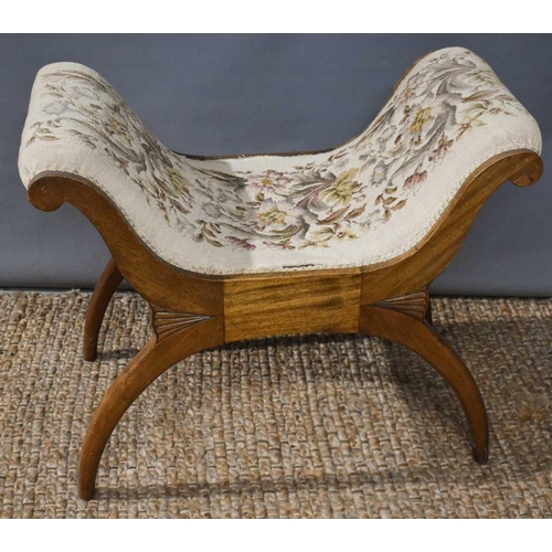 463 - A 20th century X-frame stool with needle point upholstery.