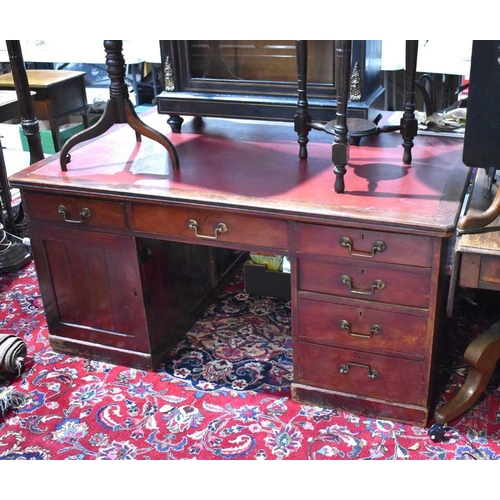 465 - A large Victorian mahogany pedestal desk with red leather top, one side with pedestal of four drawer... 