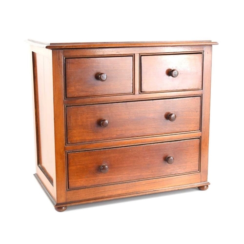 469 - A 19th century mahogany apprentice or salesman's piece chest of drawers with two short over two long... 