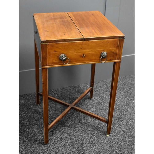 473 - A Regency period mahogany work table, the bifold top opens out to reveal a baise lined top, above a ... 