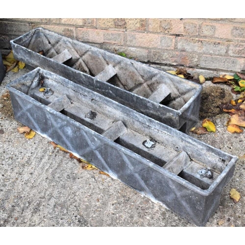 474 - A pair of lead window boxes, 86cms by 17cms by 16.5 cms tall