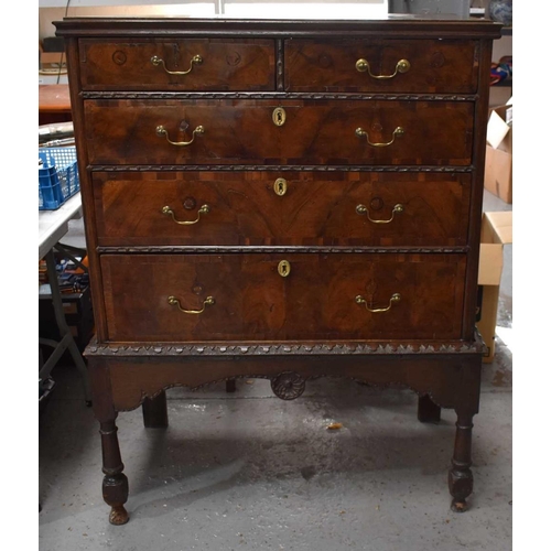 482 - A 19th century ( with earlier elements) walnut and oak chest on stand, two short over three long gra... 