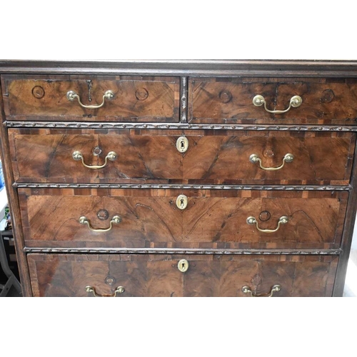 482 - A 19th century ( with earlier elements) walnut and oak chest on stand, two short over three long gra... 