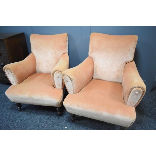 489 - A pair of Howard style armchairs, upholstered in pink velour, with square tapered oak feet raised on... 