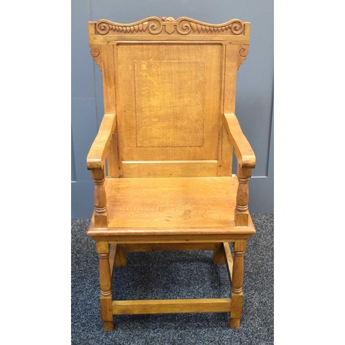 494 - An Arts and Crafts style oak hall chair with carved mouse to the top rail, in the manner of Robert M... 