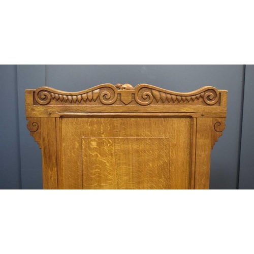 494 - An Arts and Crafts style oak hall chair with carved mouse to the top rail, in the manner of Robert M... 