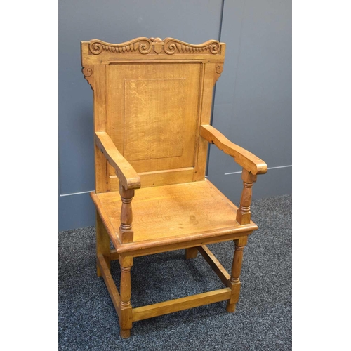 494 - An Arts and Crafts style oak hall chair with carved mouse to the top rail, in the manner of Robert M... 