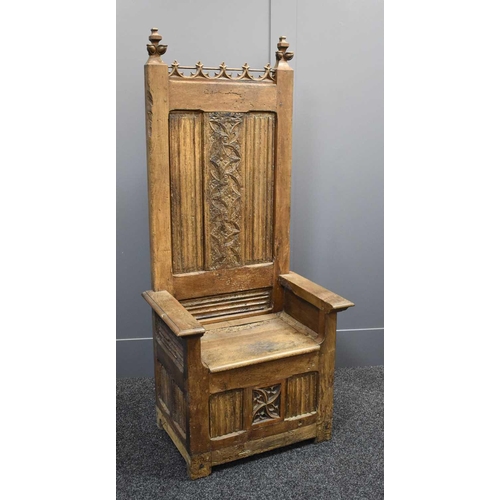 498 - A 16th century French oak throne chair, with 19th century restorations, the tall back having lobed f... 