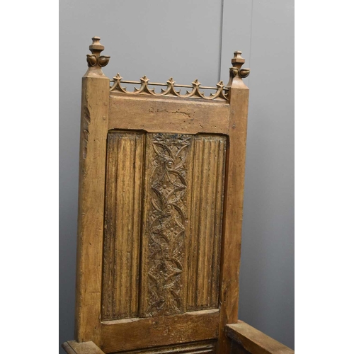 498 - A 16th century French oak throne chair, with 19th century restorations, the tall back having lobed f... 