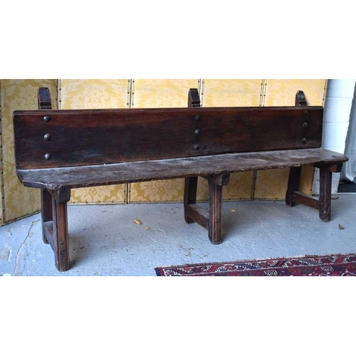 499 - A 17th century Spanish long bench, composed to two planks and three supports united with large iron ... 