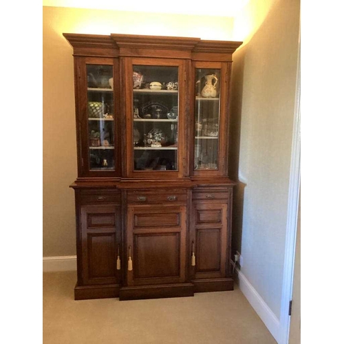 483 - A Victorian Indian rosewood breakfront bookcase, fitted with three cupboards, three drawers and glaz... 