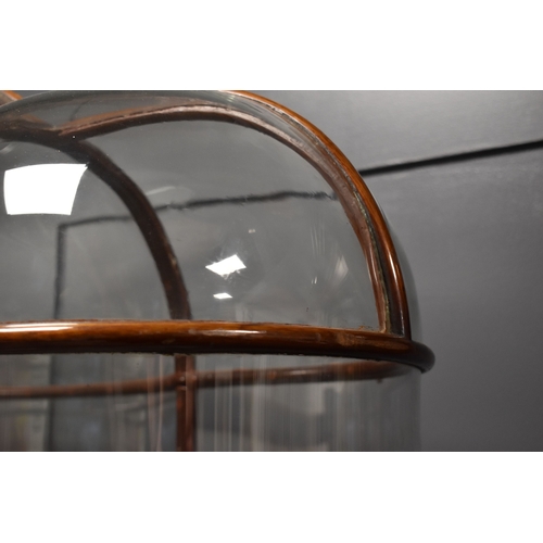 500 - An unusual and impressive mahogany and glass display cabinet, with triple domed top and curved ends,... 