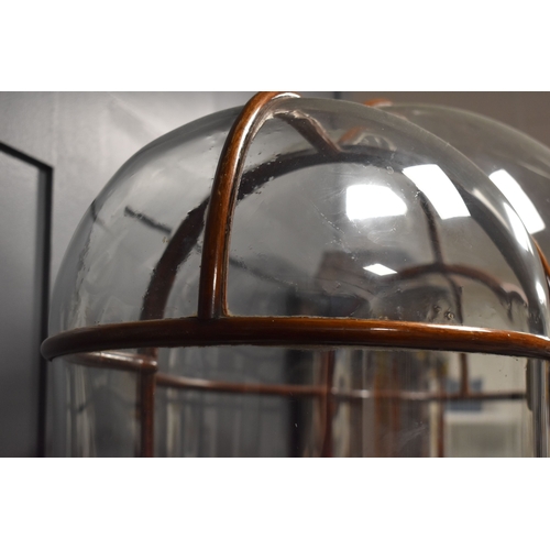 500 - An unusual and impressive mahogany and glass display cabinet, with triple domed top and curved ends,... 