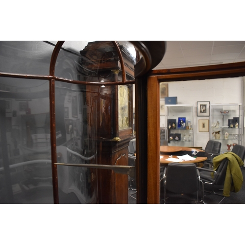 500 - An unusual and impressive mahogany and glass display cabinet, with triple domed top and curved ends,... 