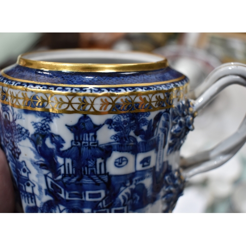 212a - A 19th century Chinese export blue and white teapot and cover, with gilded highlights, the cover wit... 