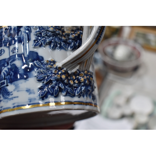 212a - A 19th century Chinese export blue and white teapot and cover, with gilded highlights, the cover wit... 