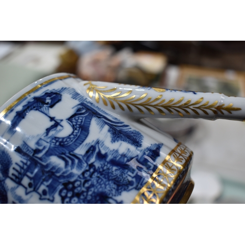 212a - A 19th century Chinese export blue and white teapot and cover, with gilded highlights, the cover wit... 