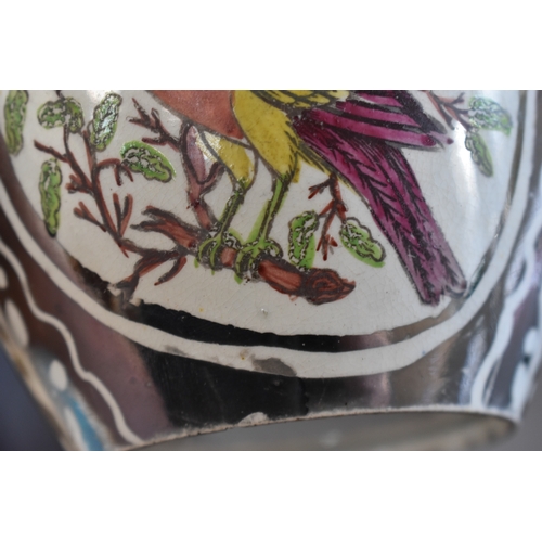 222 - A Victorian lustre jug depicting bird in a roundel with silvered ground, together with a Delft cow f... 