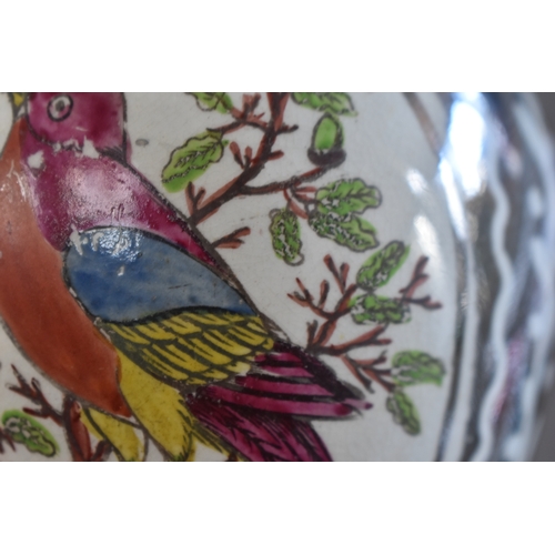 222 - A Victorian lustre jug depicting bird in a roundel with silvered ground, together with a Delft cow f... 