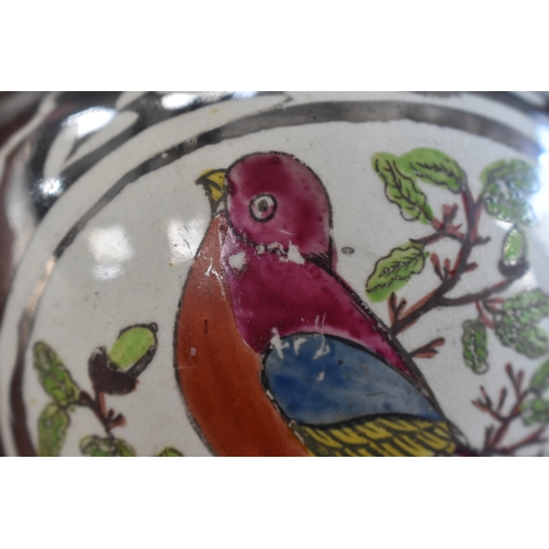 222 - A Victorian lustre jug depicting bird in a roundel with silvered ground, together with a Delft cow f... 