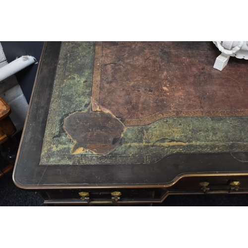 485 - A Regency period ebonised ladies desk, manner of Gillows, with gilt brass handles and beading, and a... 