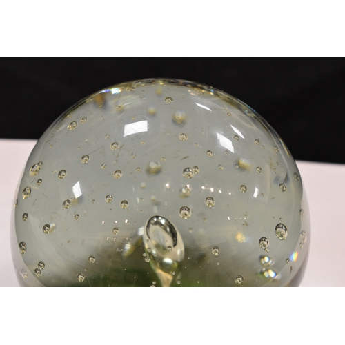 207 - A group of glass paperweights to include millefiori, tear drop and other examples.