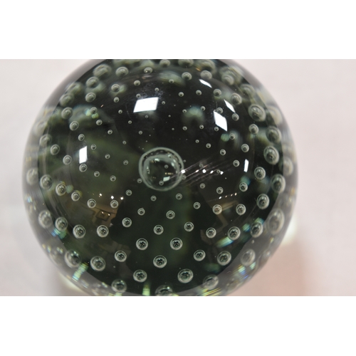 207 - A group of glass paperweights to include millefiori, tear drop and other examples.