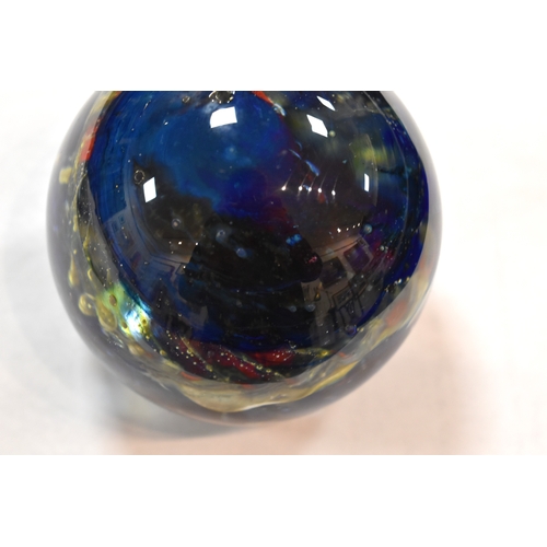 207 - A group of glass paperweights to include millefiori, tear drop and other examples.