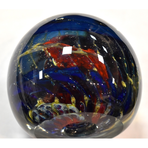 207 - A group of glass paperweights to include millefiori, tear drop and other examples.