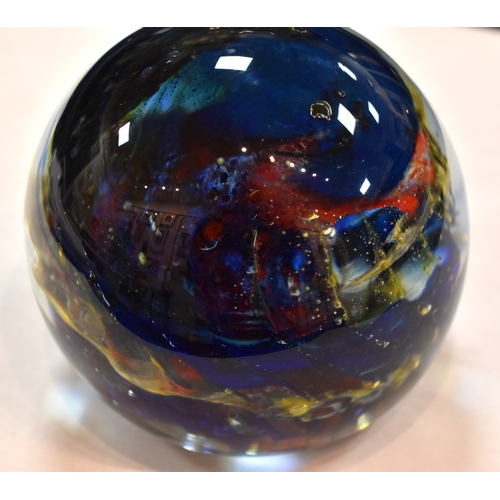 207 - A group of glass paperweights to include millefiori, tear drop and other examples.