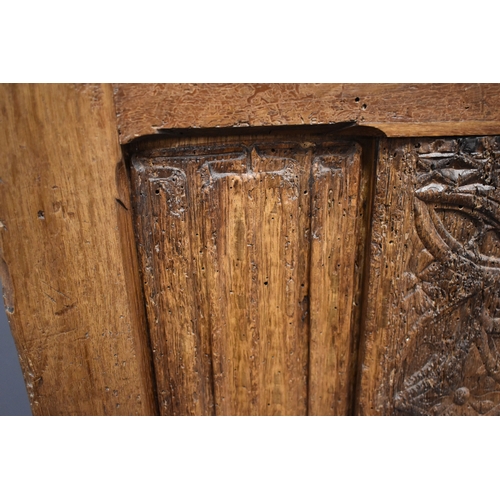 498 - A 16th century French oak throne chair, with 19th century restorations, the tall back having lobed f... 