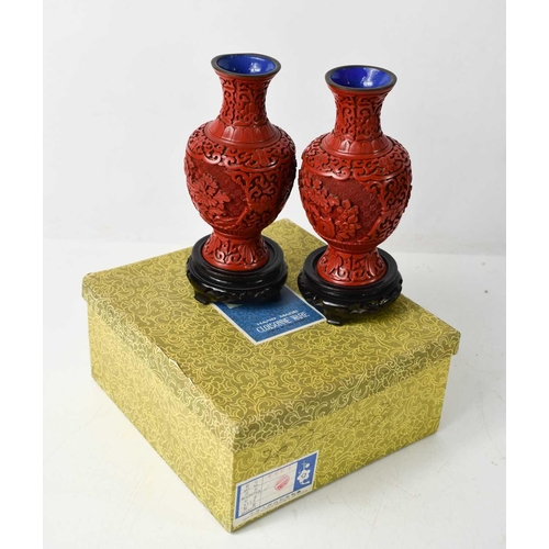 115 - A pair of 20th century Chinese Cinnabar vases, in the original presentation box.