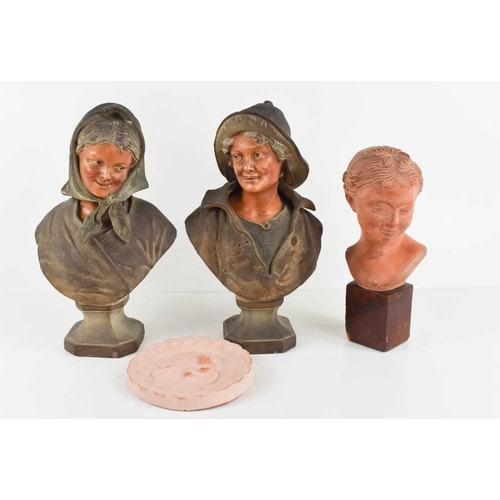 123 - A pair of early 20th century chalkware pottery busts, peasants, one stamped BU 525 verso, together w... 