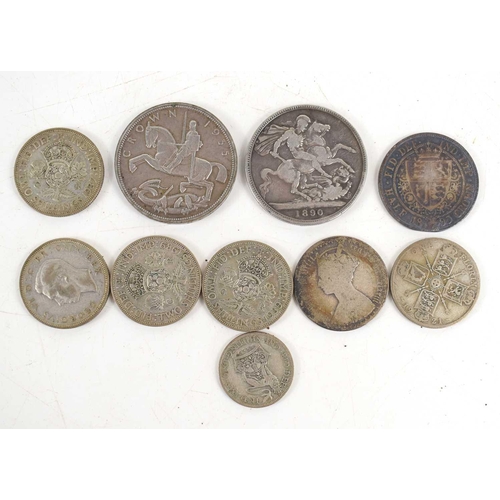 130 - A group of silver coins to include a 1935 and 1890 crown, half crowns and others.