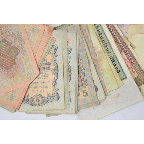 141 - A large group of late 19th and early 20th century bank notes, mostly pre-revolution Russian Rubles, ... 