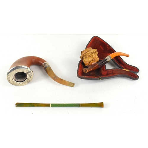 151 - A silver mounted calabash smoking pipe together with a Meerschaum pipe, the bowl in the form of a la... 