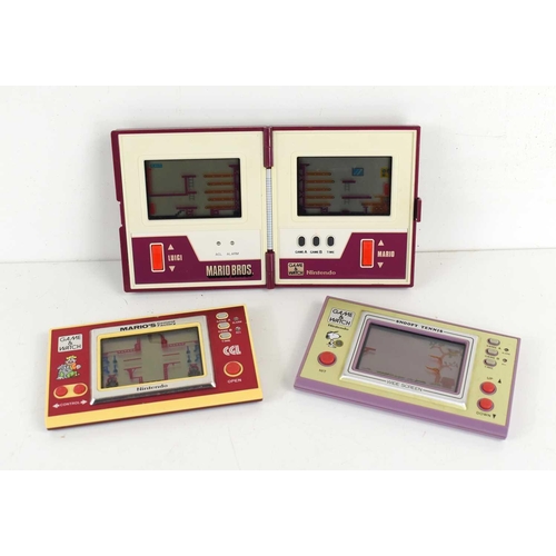 16 - A group of three Nintendo Game and Watch hand held consoles, comprising Mario Bros Multi Screen, Mar... 