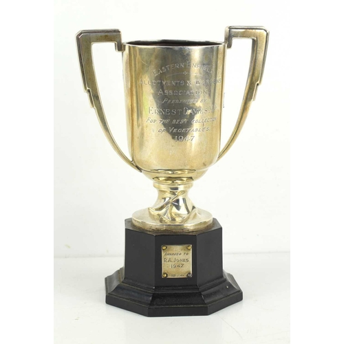 165 - A silver trophy, with twin handles and bearing presentation inscription dated 1947 for the best coll... 