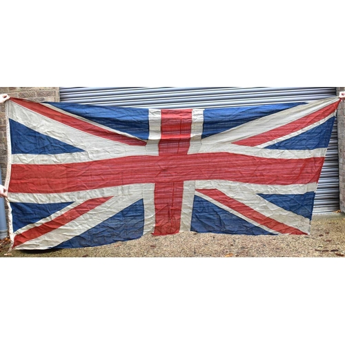 194 - A large Naval Union Jack flag, early 20th century, double stitched, 129cm by 282cm.