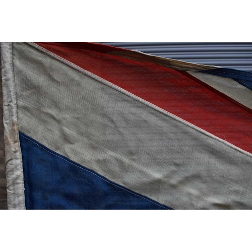 194 - A large Naval Union Jack flag, early 20th century, double stitched, 129cm by 282cm.