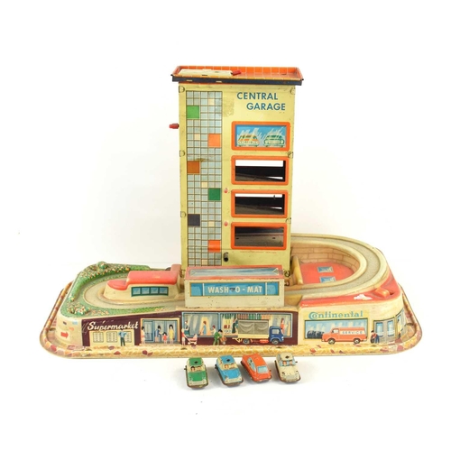 2 - A vintage 1950s / 60s Technofix tin plate and plastic Central Garage with four cars.