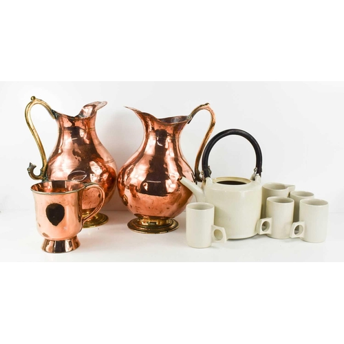 200 - A pair of Copper Arts & Crafts style jugs, a copper tankard, and a Studio pottery part tea set.