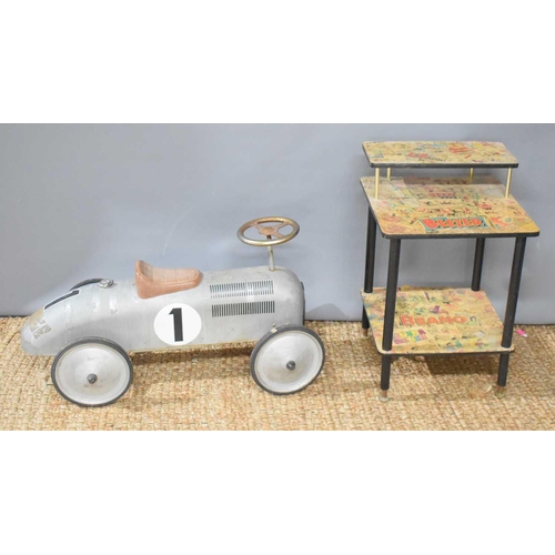 25 - A vintage side table decoupaged with Beezer and Beano comics together with a metal child's racing ca... 