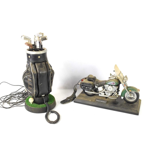 29 - A novelty telephone in the form of a bag of golf clubs and a Harley Davidson telephone.