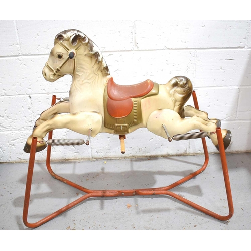 32 - A vintage tin plate rocking horse, the horse suspended on springs and a steel frame.