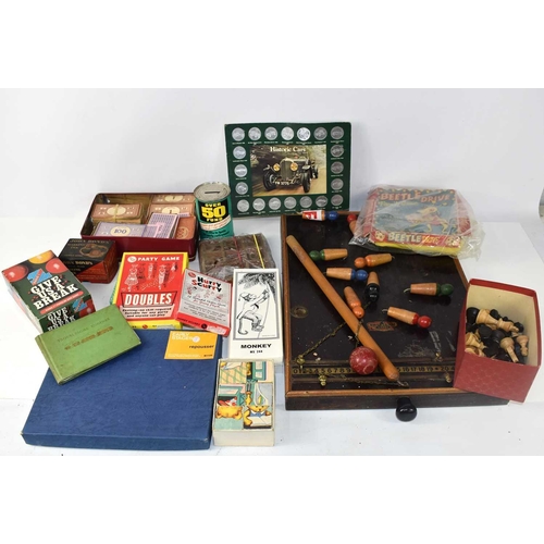 35 - A group of vintage games to include Amersham table skittles, Beetle drive, Monopoly money, chess pie... 