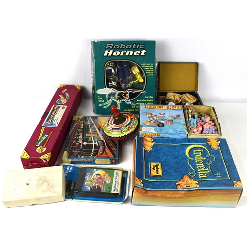 39 - A group of vintage toys and games to include a boxed Selcol Silvertone clarinet, tin plate spinning ... 